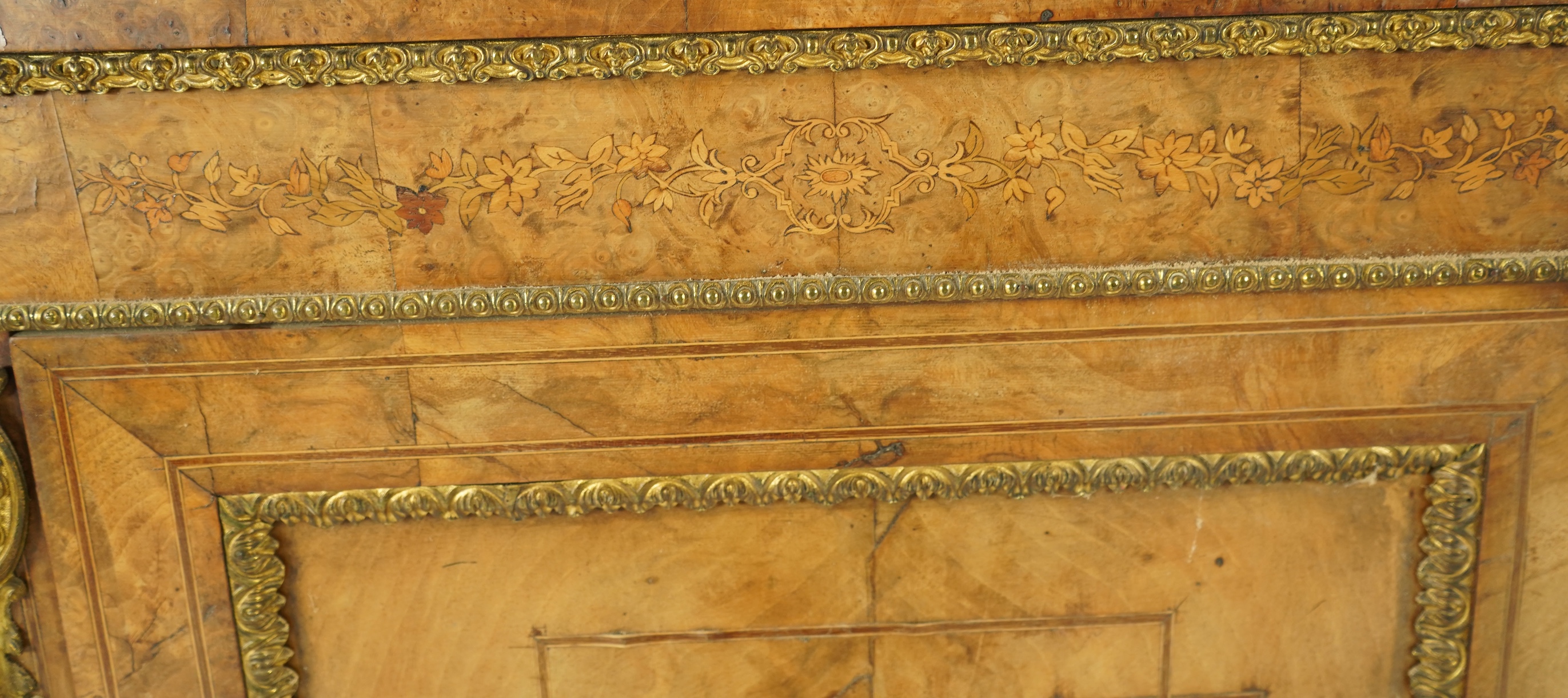 A Victorian marquetry inlaid, gilt metal mounted bowfront side cabinet